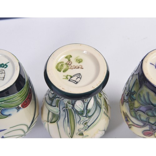 911 - Four various Moorcroft Vases Complete with Boxes & Paperwork. Measuring: 9.5cms. (Approx).