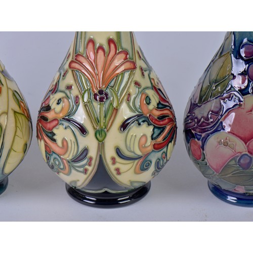 912 - Four various Flared Necked Moorcroft Vases Complete with Boxes & Paperwork. Measuring: 14cms High. (... 