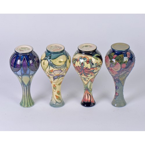 912 - Four various Flared Necked Moorcroft Vases Complete with Boxes & Paperwork. Measuring: 14cms High. (... 