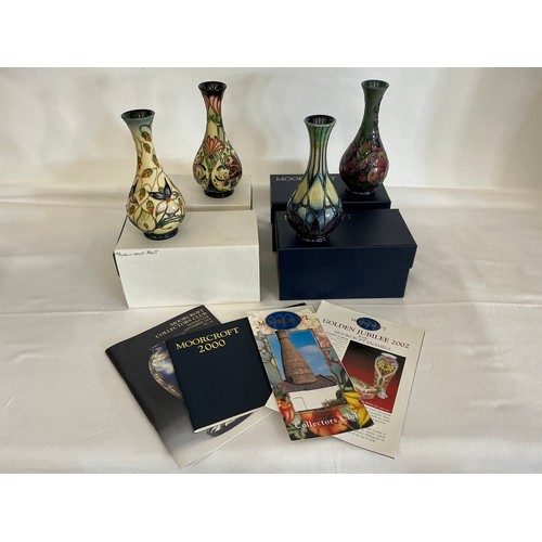 912 - Four various Flared Necked Moorcroft Vases Complete with Boxes & Paperwork. Measuring: 14cms High. (... 