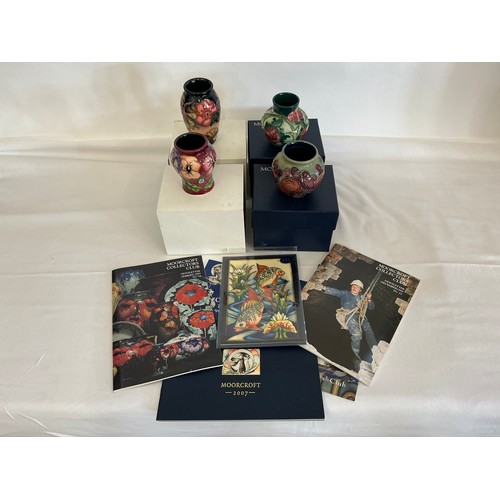 913 - Four various Moorcroft Vases Complete with Boxes & Paperwork. Measuring: 10cms. (Approx).
