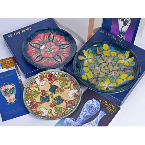 915 - A Blue & Green Glazed Moorcroft Pottery Saucer Dish decorated with Flowers & Two Moorcroft Year Plat... 