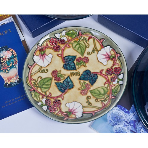 915 - A Blue & Green Glazed Moorcroft Pottery Saucer Dish decorated with Flowers & Two Moorcroft Year Plat... 