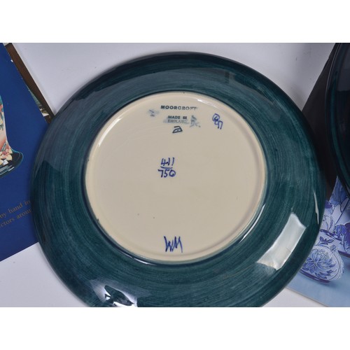 915 - A Blue & Green Glazed Moorcroft Pottery Saucer Dish decorated with Flowers & Two Moorcroft Year Plat... 