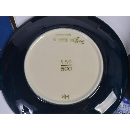 915 - A Blue & Green Glazed Moorcroft Pottery Saucer Dish decorated with Flowers & Two Moorcroft Year Plat... 