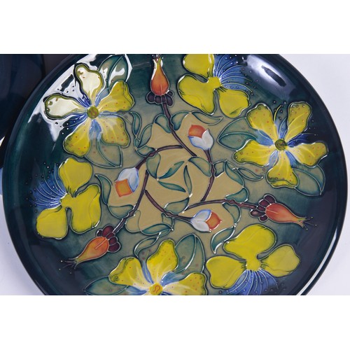 915 - A Blue & Green Glazed Moorcroft Pottery Saucer Dish decorated with Flowers & Two Moorcroft Year Plat... 