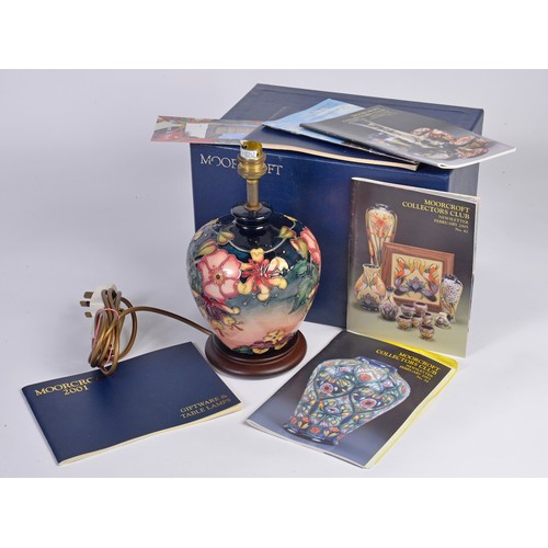 916 - A Fuchsia decorated Moorcroft Lamp Complete with the Original Box & Paperwork. Measuring: 18cms High... 