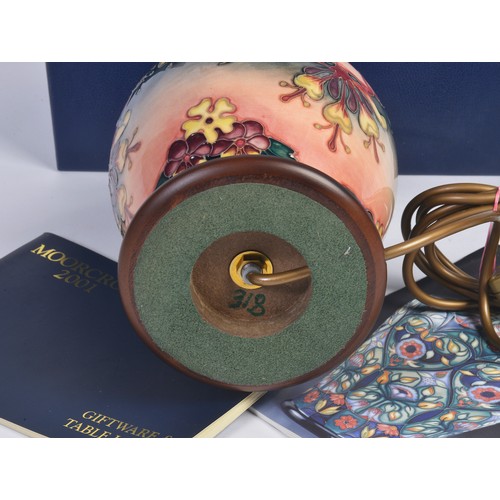 916 - A Fuchsia decorated Moorcroft Lamp Complete with the Original Box & Paperwork. Measuring: 18cms High... 