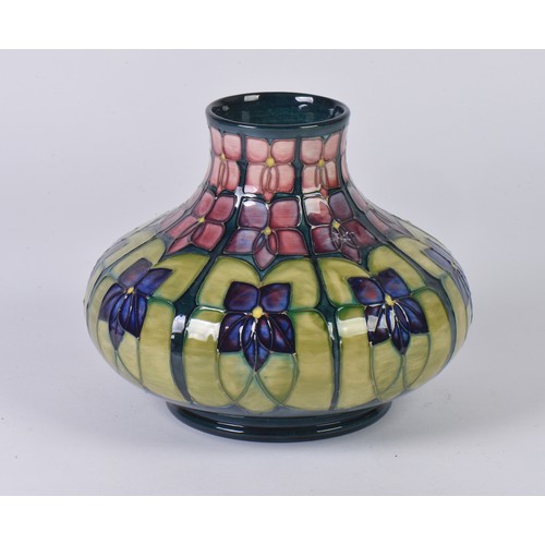 917 - An Art Nouveau design Squat patterned Moorcroft Vase decorated in Purple & Green Complete with Origi... 