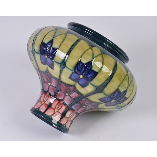 917 - An Art Nouveau design Squat patterned Moorcroft Vase decorated in Purple & Green Complete with Origi... 