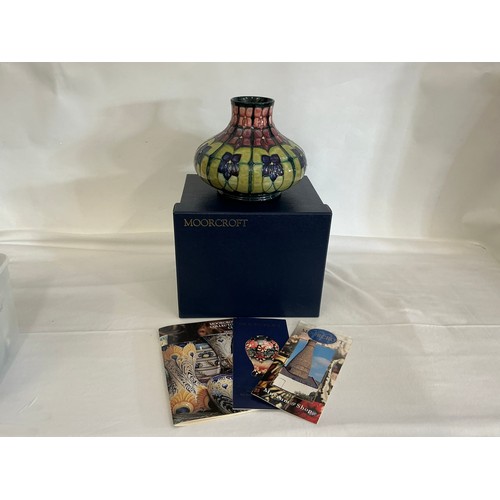 917 - An Art Nouveau design Squat patterned Moorcroft Vase decorated in Purple & Green Complete with Origi... 