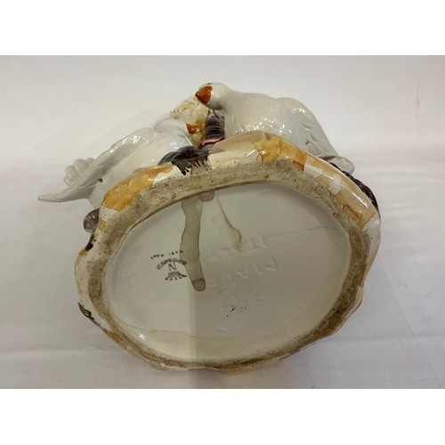 919 - An Italian Porcelain Vase decorated with Doves. Marked N. Measuring: 42cms.