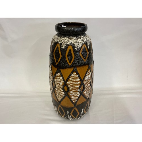 923 - A Fat Lava German Lava Glazed African Stool pattern Vase. Measuring: 48cms High.