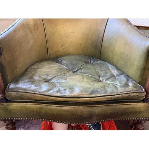 651 - A Mahogany Framed Green Leather & Studied Hoop Back chair resting on turned Legs.