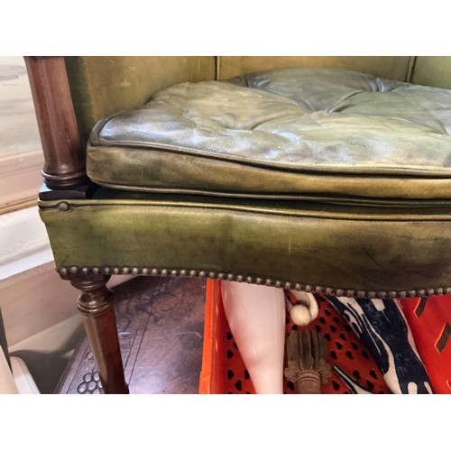 651 - A Mahogany Framed Green Leather & Studied Hoop Back chair resting on turned Legs.