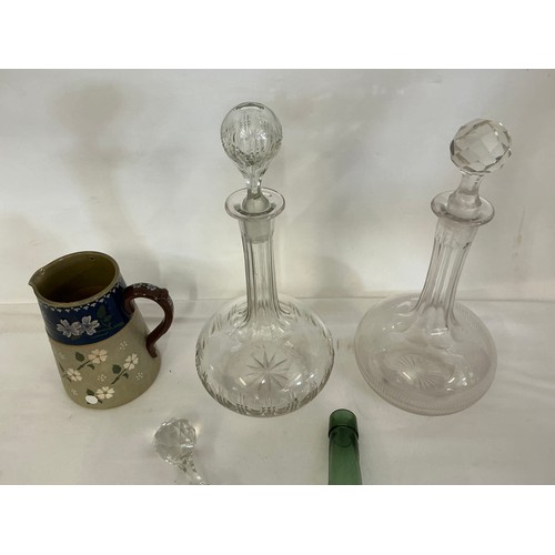 725 - A Green Bottle Shaped Vase taken from Dunkirk, two decanters & a Lovett Jug.