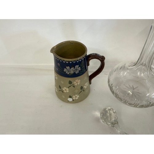 725 - A Green Bottle Shaped Vase taken from Dunkirk, two decanters & a Lovett Jug.