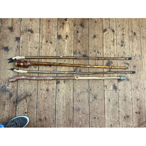 1083 - A Collection of Four Walking Sticks.