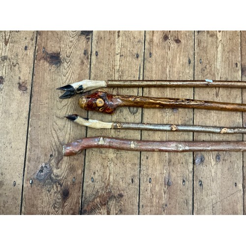 1083 - A Collection of Four Walking Sticks.