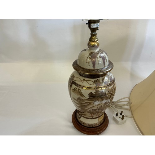 781 - A Japanese Satsuma design Table Lamp depicting a Group of Warriors & Attendants coming down a mounta... 