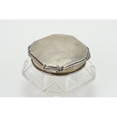 26 - A Art Deco 1933 silver topped and cut glass trinket pot by Walker and Hall. Weight of lid 33.9g.