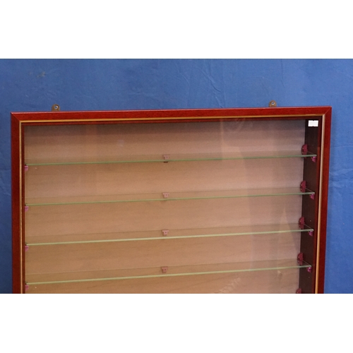583 - A Modern Mahogany Wall Hanging Cabinet with a Glass Door & Nine Glass Display Shelves. Measuring: 66... 