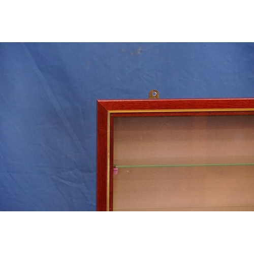 583 - A Modern Mahogany Wall Hanging Cabinet with a Glass Door & Nine Glass Display Shelves. Measuring: 66... 
