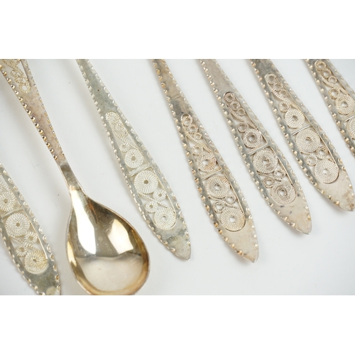 33 - A set of five 1970s Russian desert spoons and forks in a filigree design. Along with one extra spoon... 