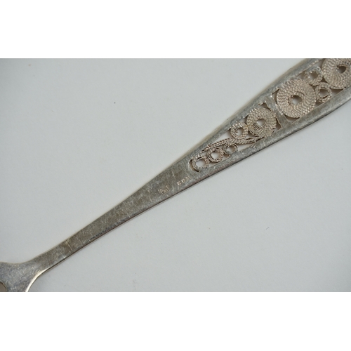 33 - A set of five 1970s Russian desert spoons and forks in a filigree design. Along with one extra spoon... 