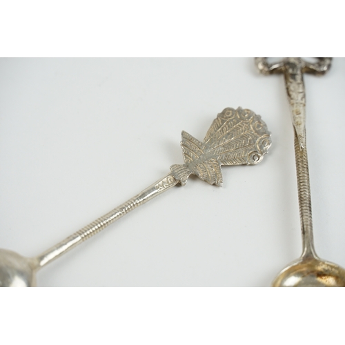 39 - A collection of foreign silver teaspoons, decorated with various animals and trees. Weight 78g.