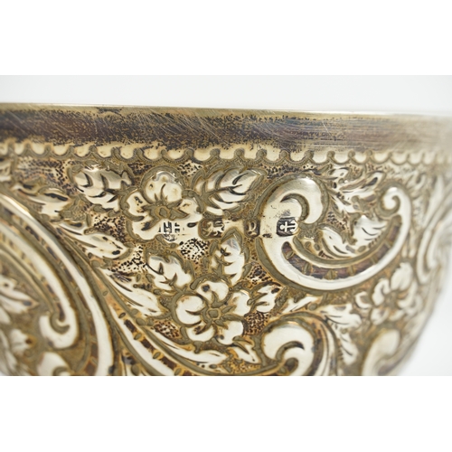 53 - A Victorian silver floral decorated bowl, possibly by Thomas Hayes. Hallmarked 1881 Birmingham. Weig... 