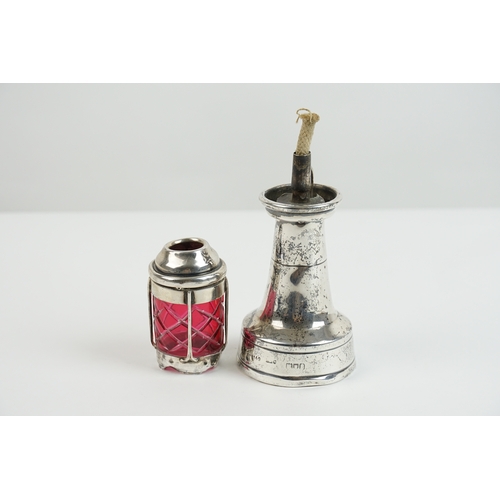 55 - A interesting silver oil lamp, designed as a lighthouse. The lighthouse features ruby coloured glass... 