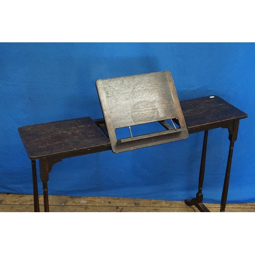 585 - An Edwardian Oak Bedside Reading Table resting on Pad Feet. Measuring: 95cms across x 28cms deep x 7... 