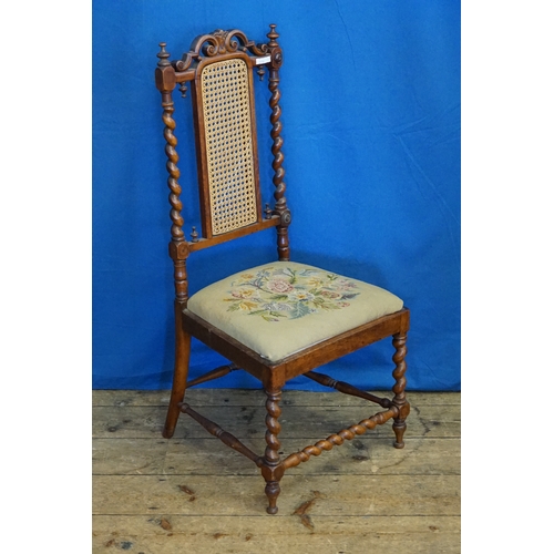 594 - A Victorian Cane Back Sewing Chair with Barley Twist supports.