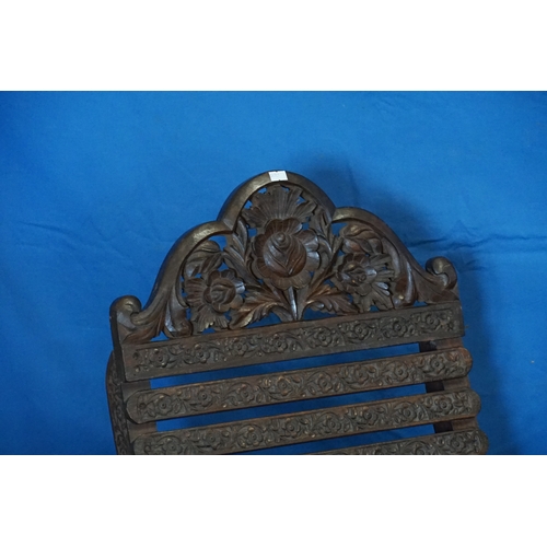 610 - A Pair of Cashmere Carved Splat Back Folding Travellers Chairs with carved cresting Rail.
