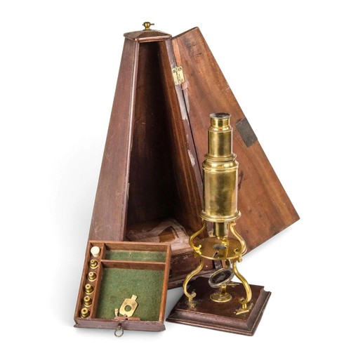 A Rare Georgian Brass cased made by Dollond of London, Culpeper's microscope with gimble glass mirrored mount fitted interior draw, extra lense and contained in a shaped original mahogany case