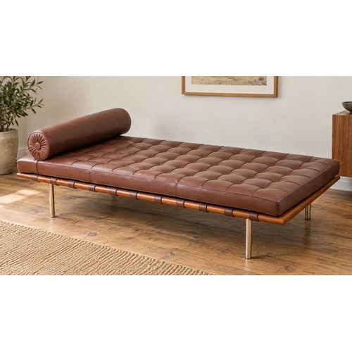 A Knoll Barcelona day bed, fitted with brown leather piped cushion, after a 1969 design by Mies van der Rohe, width 196cm by 95cm