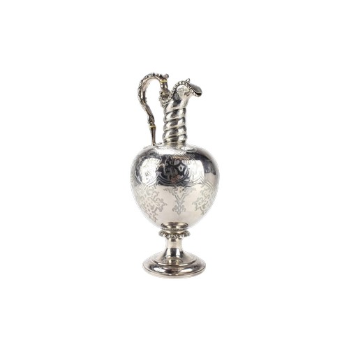 A Robert Hennel Victorian Silver engraved and chased claret jug, mask and claw decoration with ivory insulators. London 1878. Total weight 28.62 oz.
