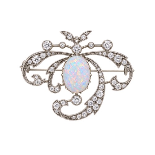 A Beautiful Victorian Large Opal & Diamond Brooch with 9ct Gold & Silver Mount. Size of Opal: 3ct Approx. Size of Largest Diamond. O.10ct. Measuring 3.5cm x 3cm.