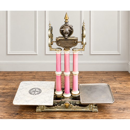 A Lovely Set of Victorian Wrought & Cast Iron Scales with Pink Pottery Columns with a Marble effect base marked "Parnall & Sons Limited" Narrow Wine Street, Bristol. Measuring: 90cms high x 75cms across x 37cms deep.