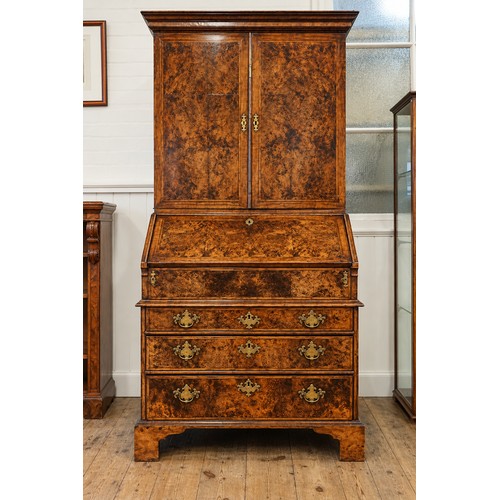 An early 18th Century walnut feather banded and stained field maple bureau bookcase. (Email from Bonhams listing the item 9th February 2015).
Measuring: Bottom Depth: 62cms x Top Depth: 35cms x Total Height: 195cms x across 99cms.