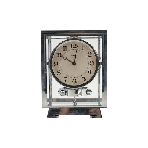 A "Jaeger-LeCoultre" Chromium Cased Modernistic Atlas Clock with a Nickel Silver Face, Oscillating Mechanism in an Original Atmos Box.