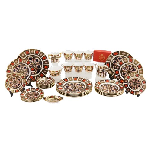 A Royal Crown Derby English Bone China Dinner Set No: 1128 decorated in Rust, Blue & Gold consisting of Dinner Plates, Second Course Plates, Third Course Plates, Saucers, Cups, Milk Jug, Serving Dishes & a Boxed Two Handled Loving Cup, along with a part Tea Set.
