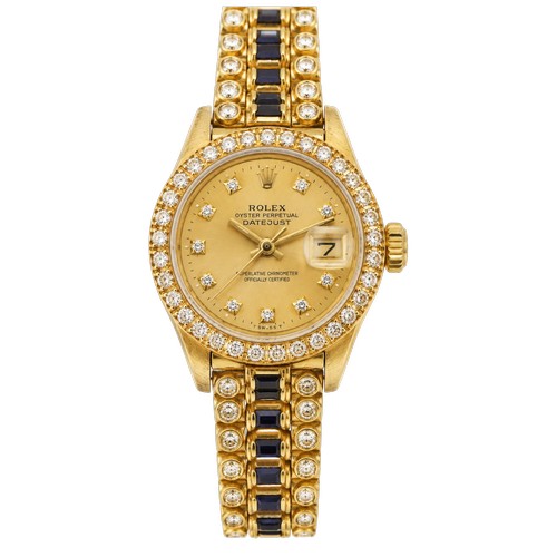 An interesting 18ct gold ladies Rolex oyster date just, circa 1970's. Unique sapphire and diamond octopus bracelet, diamond dial and bezel, bracelet mounted with approximately 39 sapphires and 80 diamonds. Total weight 73.6g. Contained in rare needlework Rolex box. The Case is marked 6395013.