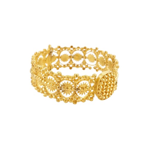 A high carat gold Iranian arm band, pinch clasp and single hinge, initials engraved inside. Weight 43.6g. Owned by.. (No. 11)
