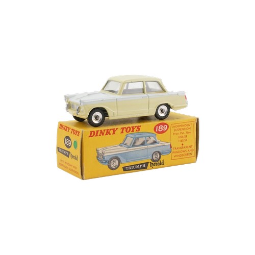 A Scarce model of a Dinky No: 189 "Triumph Herald" finished in Two-Tone Pale Yellow & Sebring White. The model is in Near Mint Original Condition & comes in an Excellent Original Green Spot Box. This model has come from it's Original Owner whose Father owned a Triumph Car Dealership in 1959. This model would have been purchased through the Parts Department & was not available to buy in Toy Shops in this Scarce colour. A Very Rare Find!!
