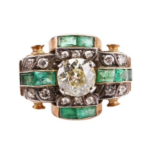 A antique art deco diamond and emerald set ring, set with a approx 2ct round cut possible fancy yellow diamond, surrounded by 8 baguette emeralds and 14 rose cut diamonds. Central diamond measuring approx 7.26mm x 7.34mm. Item was gifted to the current owners by the great uncle whom was one of the Sarkies brothers, during the opening of the raffles hotel Singapore 1887. Size M.