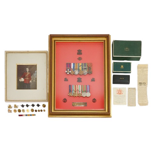 An Exceptional Set of Father & Son Medals for "Lieutenant Colonel Thomas Gilbert Mathias" of the Welsh Regiment & his Son "Lieutenant Owain E. Mathias" First Lieutenant of the Welsh Regiment , Glider Pilot & Commander. Lieut. Colonel T.G.M. World War I medals to include: A distinguished Service Order Medal (1st Award, with Crown), a 1914-1915 Star, a 1914-1920 British War Medal, a Victory Medal, an Indian General Service Medal (Waziristan 1921-1924 - Bar) & a Belgium War Cross. These medals are mounted on a bar, along with Lieut O.E.M. WWII Medals to include a 1939-1945 Star, the African Star, the Italy Star, the Defence Medal & the War Medal (1939-1945). These medals are surrounded by 7 various badges & Buttons belonging to the Father & Son accompanied with two Spink & Son boxes, a D.S.O. Garrard & Co Box along with a Bar & various other Buttons & Badges. A Framed & Glazed Picture of Thomas Gilbert Mathias, Photograph taken of him joining the Welsh Regiment. To include Newspaper Clippings from 1928 for the loss of Col. Mathias.