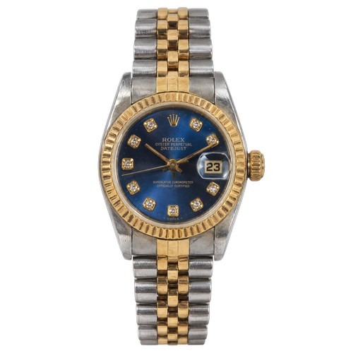A Ladies "Rolex Oyster Perpetual Date Just" in Stainless Steel & Gold with a Dark Blue Face & Diamonds Complete with the Original Box, Rolex Guarantee Certificate dated 15.12.00 & Supplied by The MW Group Limited, (No: P103610), 2000/2001 Year Calendar, Booklet & Leather Wallet. (In Working Order At Time of Listing).
