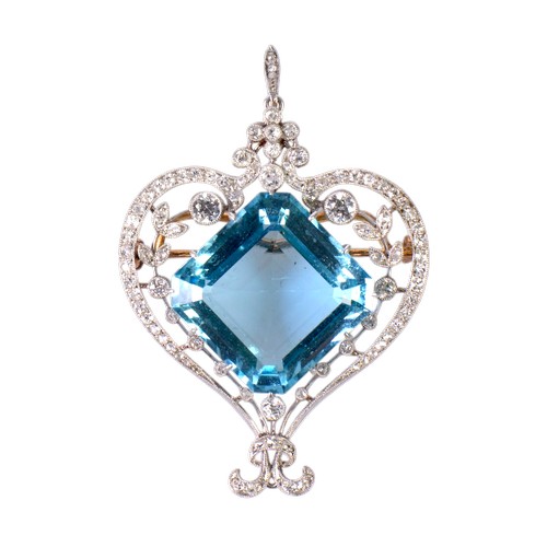 A late 19th century Belle Époque platinum and diamond set aquamarine pendant brooch, featuring an impressive Asscher cut aquamarine of approximately 22ct, measuring 19.8mm x 19.6mm x 9.31mm. Surrounded with approximately  100 diamonds, including two larger diamonds of approximately 0.20ct each. Presented in its original fitted box, showcasing the exceptional workmanship characteristic of the period.